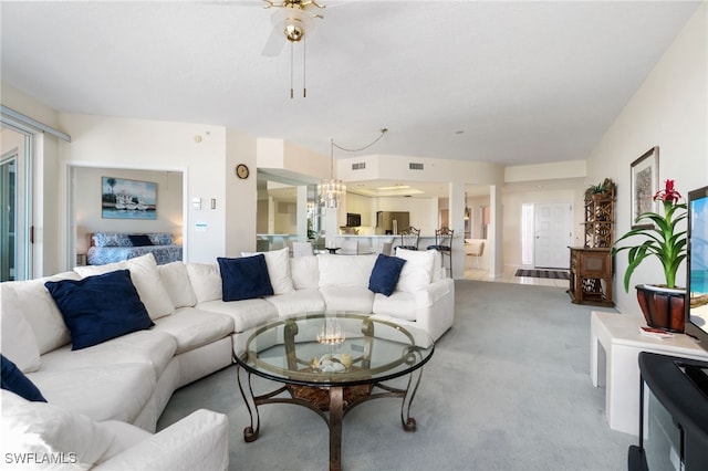 living room featuring light carpet and ceiling fan