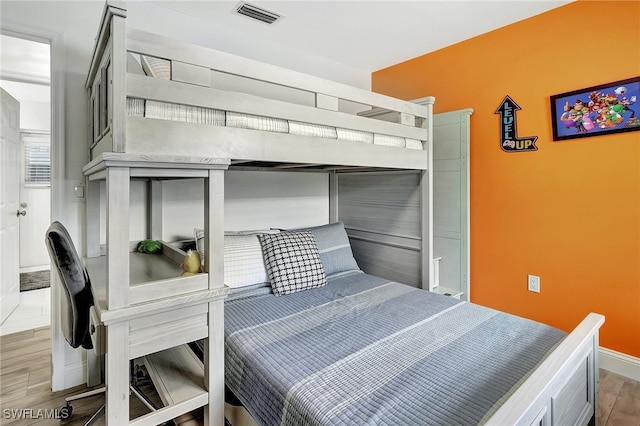 bedroom featuring hardwood / wood-style floors