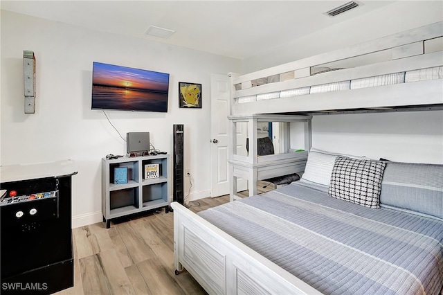 bedroom with light wood-type flooring