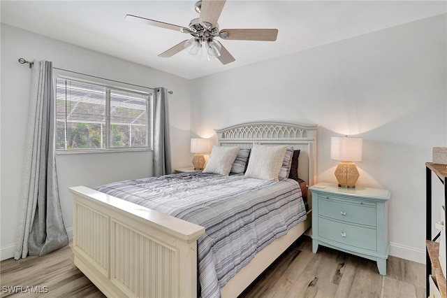 bedroom with light wood-type flooring and ceiling fan