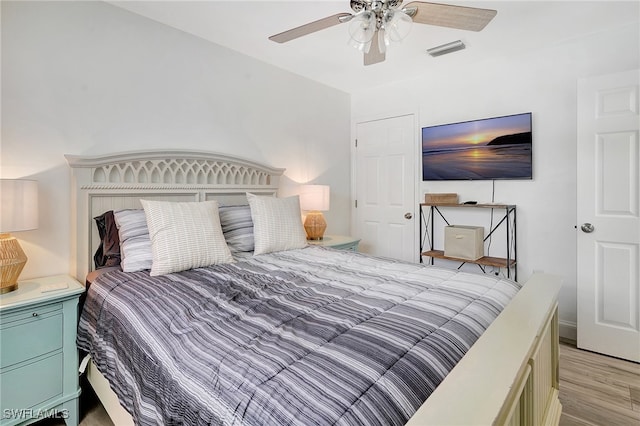 bedroom featuring ceiling fan and light hardwood / wood-style flooring