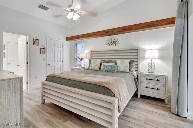 bedroom with ceiling fan, light wood-type flooring, and lofted ceiling