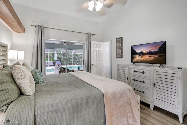 bedroom featuring ceiling fan, light wood-type flooring, access to outside, and lofted ceiling