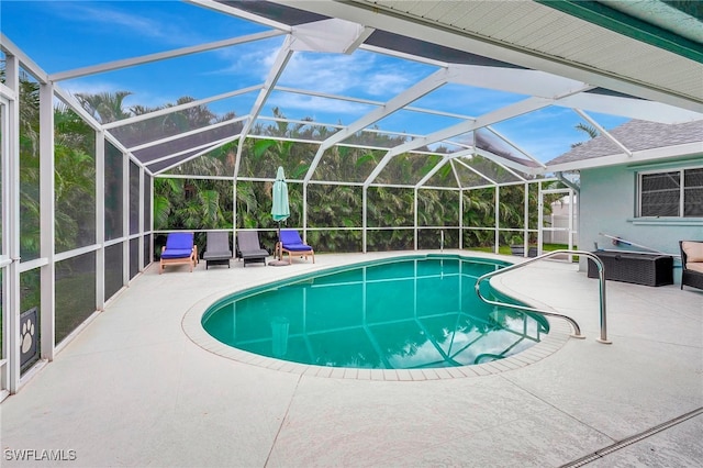 view of pool featuring a lanai and a patio area