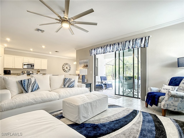 living room with crown molding, light tile patterned flooring, and ceiling fan