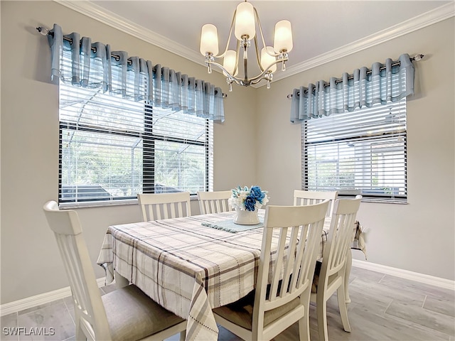 dining room with a chandelier, hardwood / wood-style flooring, plenty of natural light, and ornamental molding