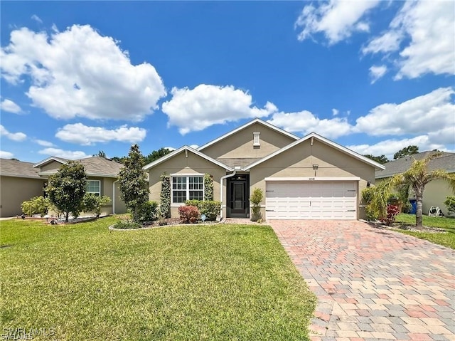 single story home featuring a garage and a front lawn