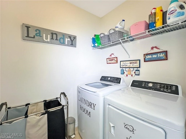 washroom with independent washer and dryer