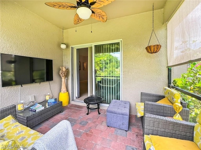 view of patio / terrace featuring ceiling fan and an outdoor hangout area