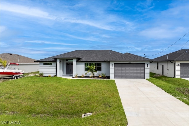 view of front facade featuring a front lawn and a garage