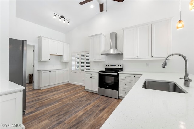 kitchen featuring wall chimney exhaust hood, stainless steel electric stove, sink, white cabinets, and dark hardwood / wood-style floors