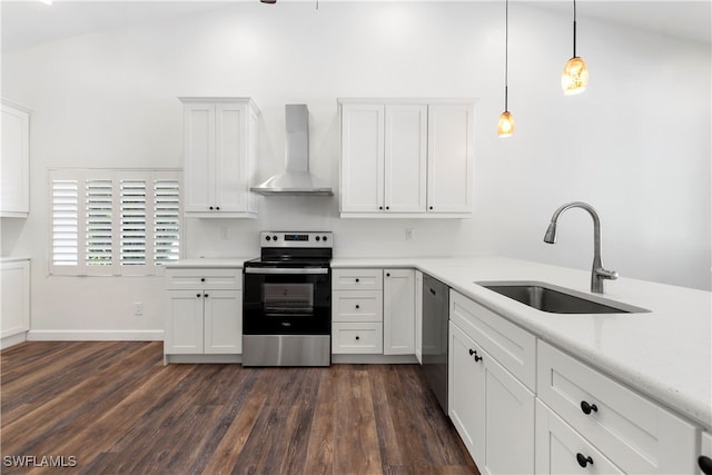 kitchen with stainless steel appliances, wall chimney range hood, pendant lighting, dark hardwood / wood-style floors, and lofted ceiling