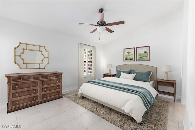 bedroom featuring vaulted ceiling, ceiling fan, and light tile patterned flooring