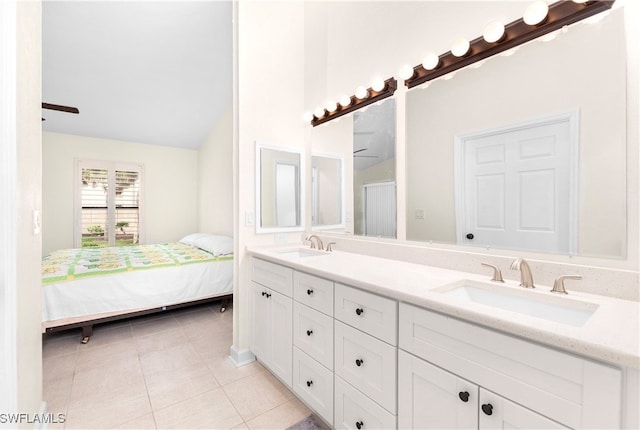 bathroom featuring tile patterned flooring and vanity