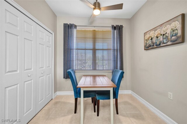 tiled dining area featuring ceiling fan