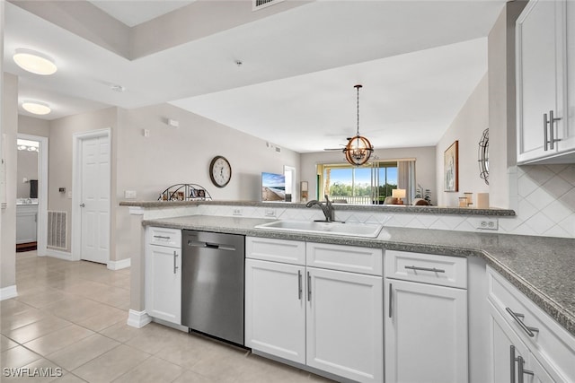 kitchen featuring visible vents, backsplash, white cabinetry, a sink, and dishwasher