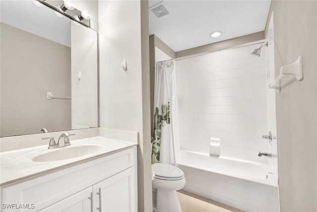 bathroom with tile patterned flooring, toilet, vanity, visible vents, and shower / bath combo with shower curtain