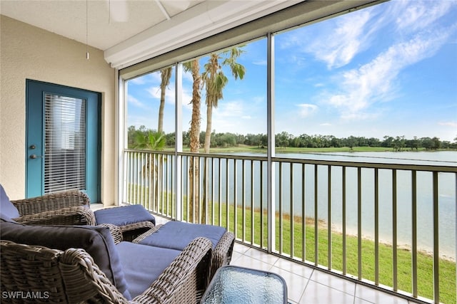 sunroom / solarium with a water view