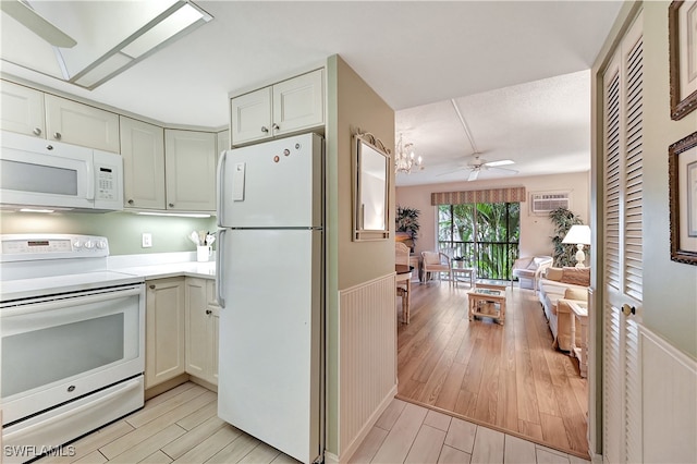 kitchen with white cabinets, white appliances, light hardwood / wood-style floors, and ceiling fan