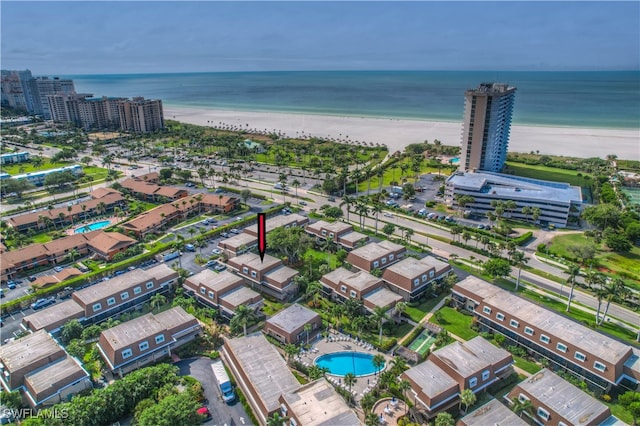 aerial view featuring a view of the beach and a water view