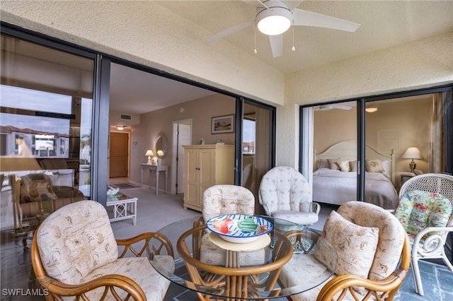 interior space featuring ceiling fan and carpet flooring