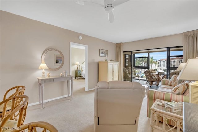 living room with light carpet and ceiling fan