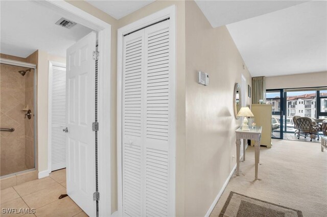 corridor with light tile patterned flooring