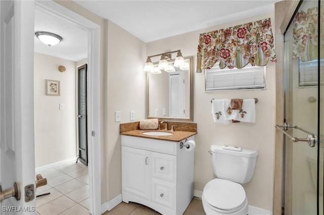 bathroom featuring walk in shower, vanity, toilet, and tile patterned flooring