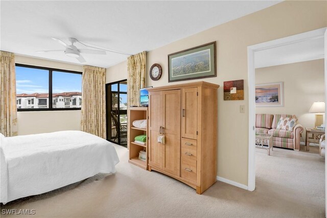 carpeted bedroom with access to exterior and ceiling fan