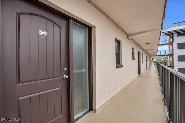 entrance to property with a balcony