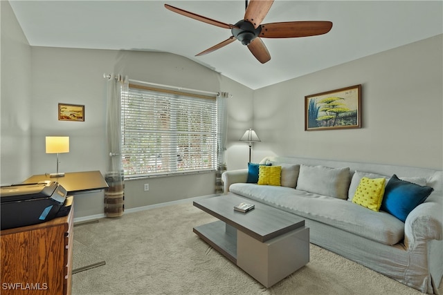 carpeted living room with ceiling fan and lofted ceiling