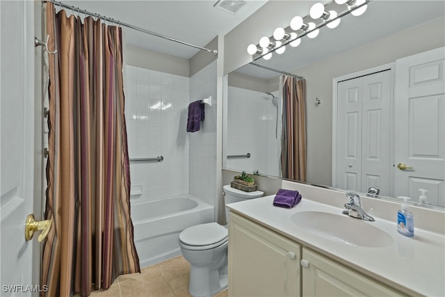 full bathroom with tile patterned floors, shower / bath combo with shower curtain, vanity, and toilet