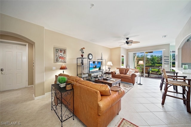 living room with light tile patterned floors and ceiling fan