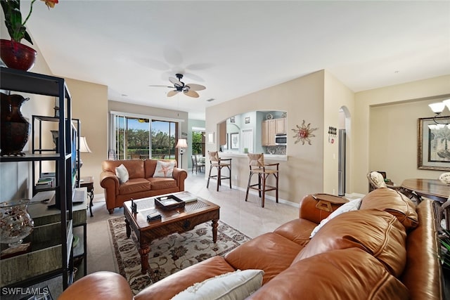 tiled living room featuring ceiling fan