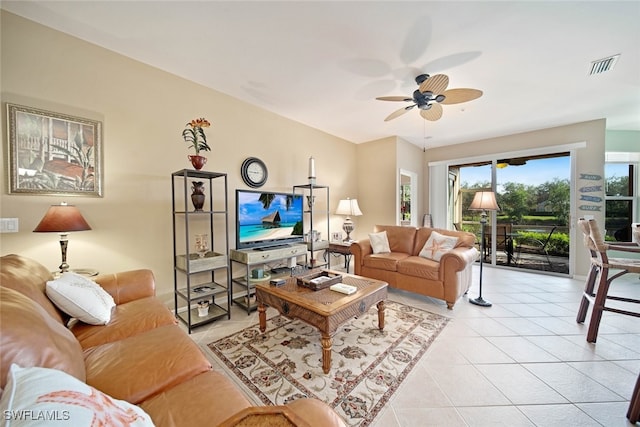 tiled living room with ceiling fan