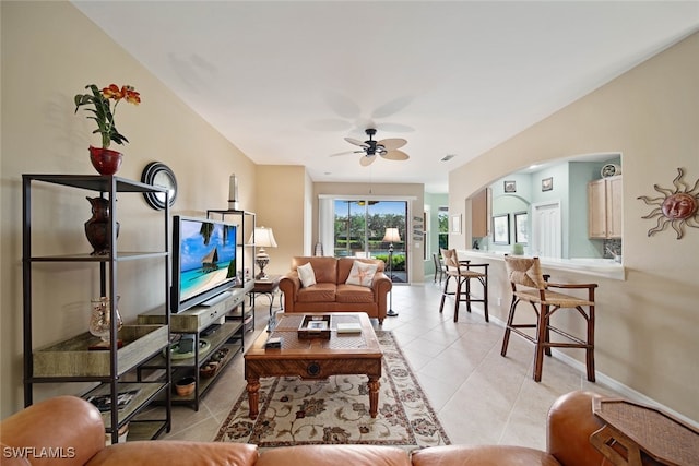 living room featuring ceiling fan and light tile patterned floors