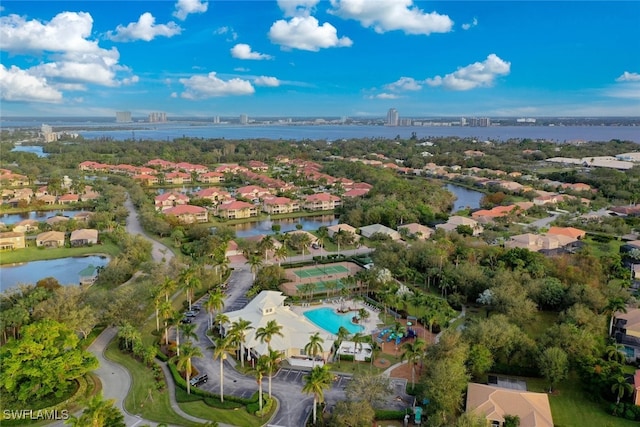 birds eye view of property with a water view