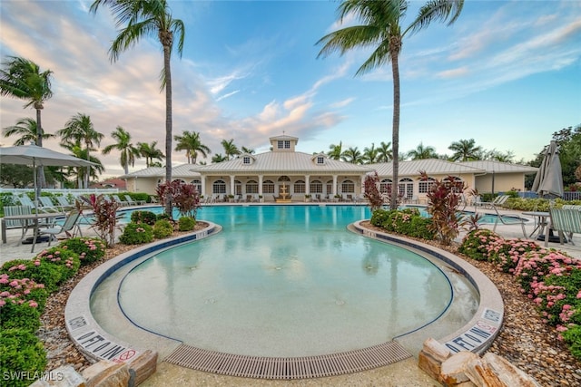 view of swimming pool with a patio