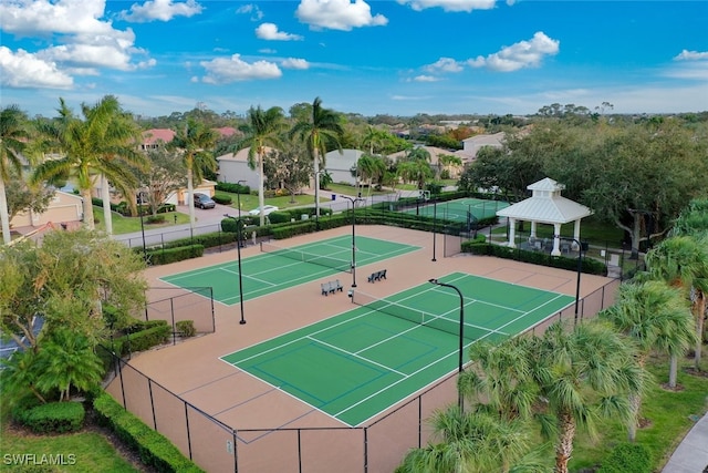 view of tennis court with a gazebo