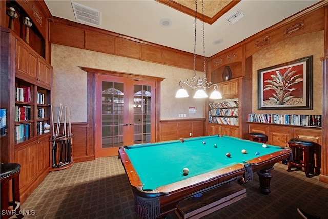 playroom featuring carpet flooring, french doors, crown molding, and built in shelves