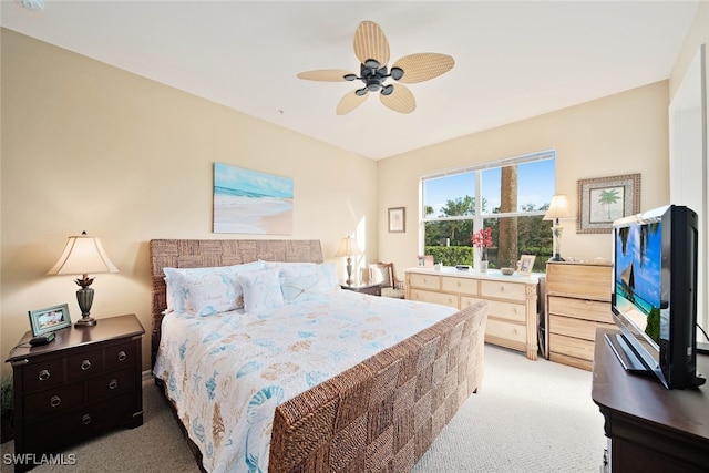 bedroom featuring ceiling fan and carpet