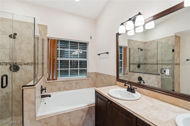 bathroom featuring vanity and plus walk in shower