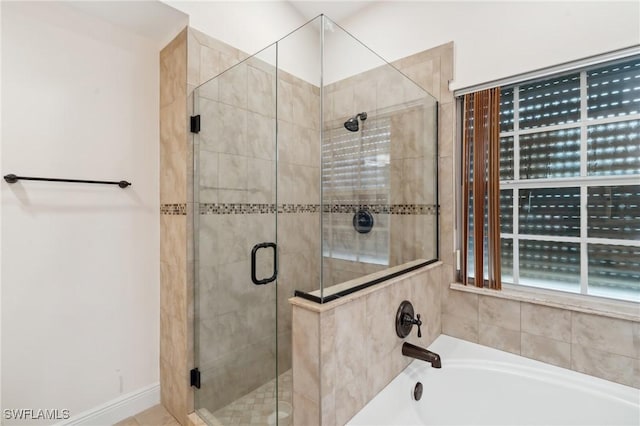 bathroom with independent shower and bath