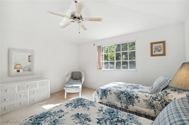 bedroom featuring ceiling fan and light carpet