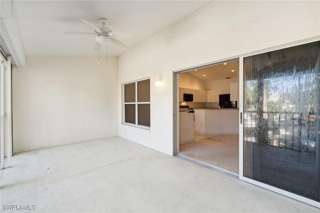 interior space featuring ceiling fan, plenty of natural light, and lofted ceiling