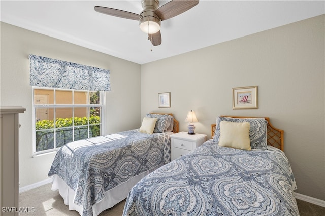 bedroom featuring ceiling fan and light carpet