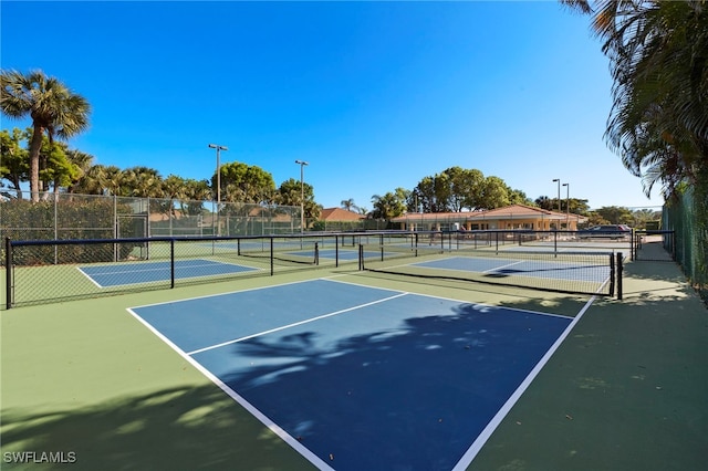 view of tennis court featuring basketball court