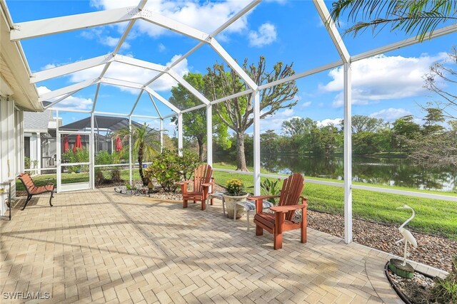 sunroom / solarium with a water view