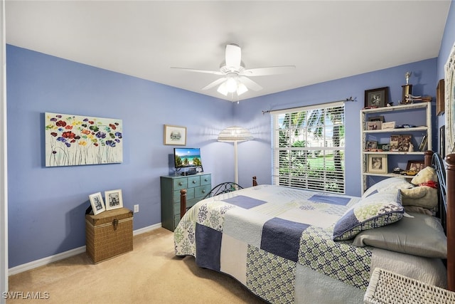 bedroom with ceiling fan and light carpet