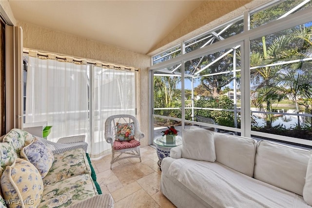 sunroom / solarium with vaulted ceiling